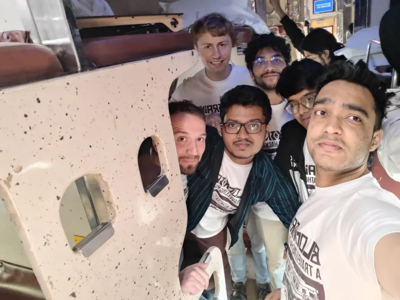 A crowded selfie of hackers inside the train coach