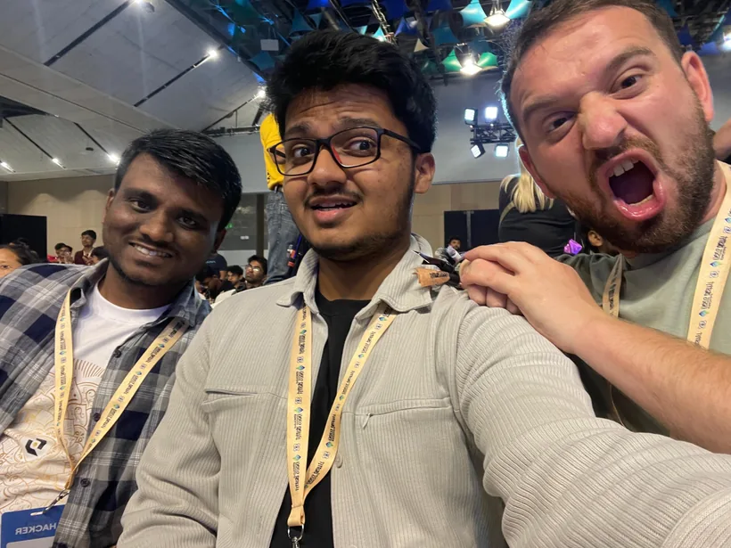 A selfie of Mirza with a teammate and an attendee pulling a face