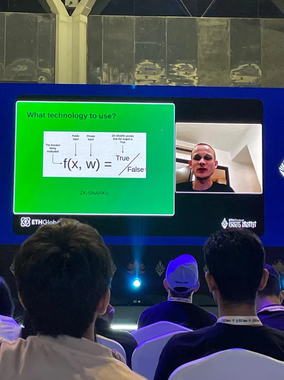 A remote talk on ZK-SNARKs on the main screen, seen from the audience
