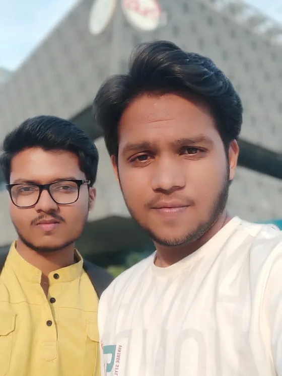A selfie of a friend with Mirza behind him outside T-Hub